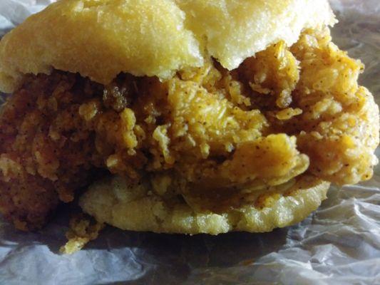 My delish chicken biscuit before i destructed it with my mouth watering and drooling its amazing and satisfying!!