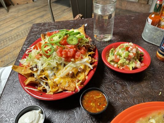 Nachos and guacamole. A delicious mound of vittles.