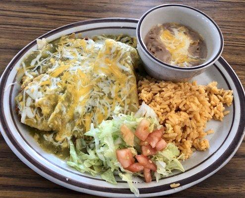 Tamales covered in green chili