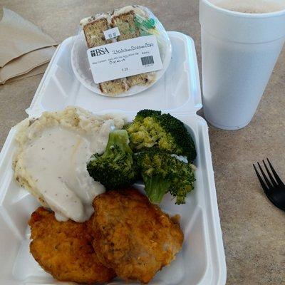 $11 for two pork chops a generous portion of mashed potatoes and gravy plus broccoli, Italian cream cake and a cappuccino.