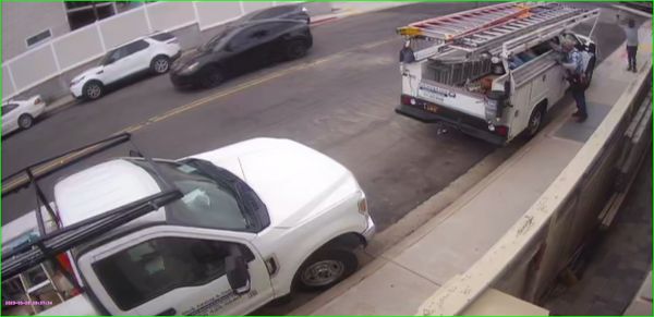 Vehicle on left has lettering "Stark Awning & Canvas", I believe.