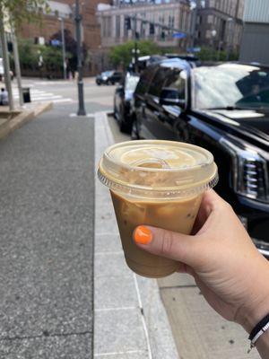 Iced vanilla latte with oat milk