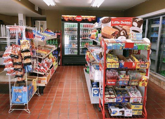 We have a small convenience section within the store. Some of the items are stored in the left corner glass-door refrigerator.