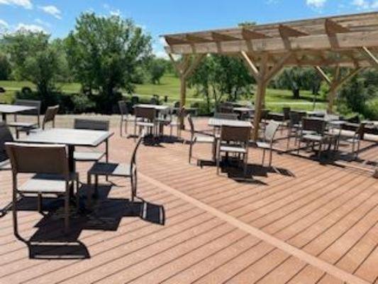 Outside seating overlooking the LaChute river and park opposite.