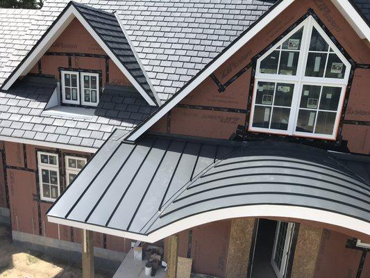 Ecostar Synthetic Slate and radiused standing seam metal