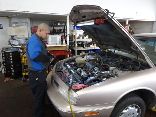 Angel repairing an engine.