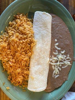 Chicken burrito real with beans and rice.