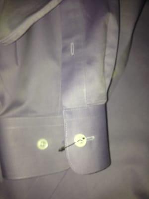 Shirt 1 - See button attached with safety pin, rather than sewn back on.