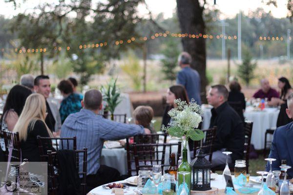 Our bistro lights come on as the sun begins to set on your reception.