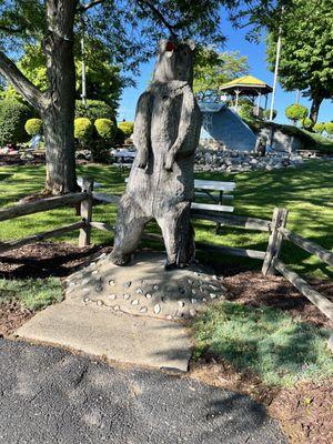 An interesting bear statue in front of the mini golf course