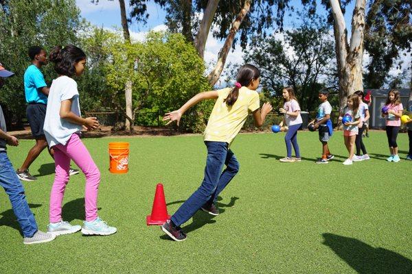 4th and 5th Graders playing a game in P.E.