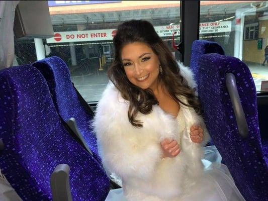 Bride, on the inside of the brand new bus.