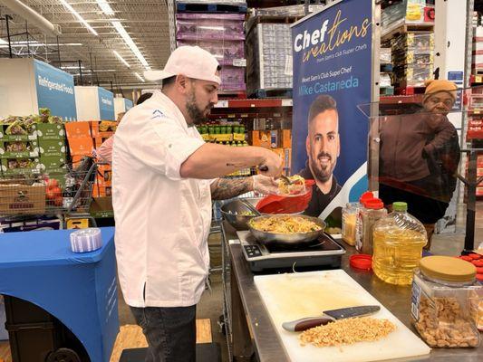 Chef promoting items in store. Passing samples of chicken stir fry.