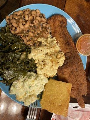 Fried cod dinner, black eyed peas, mac and cheese, greens, potato salad, and homemade corn bread.