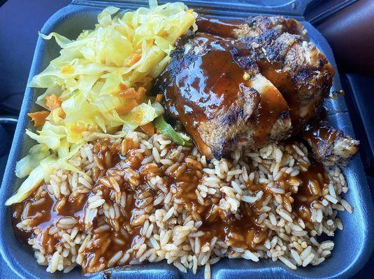 Jerk Chicken, rice and peas and cabbage.