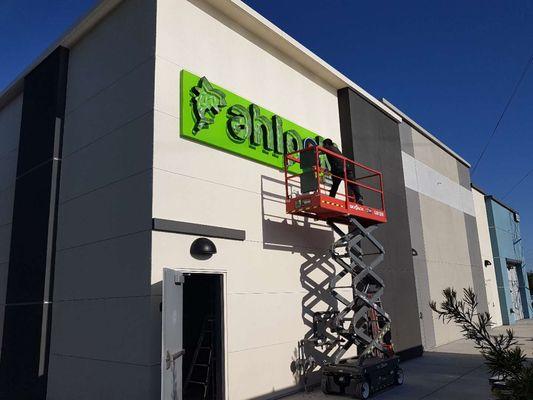 Installation of channel letter sign.