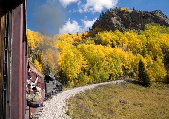 Cumbres & Toltec scenic railroad.  Train approaching a mountain peak.