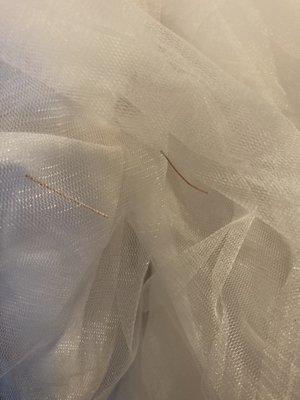 Twigs on wedding dress remaining after it was cleaned, 8/31/21