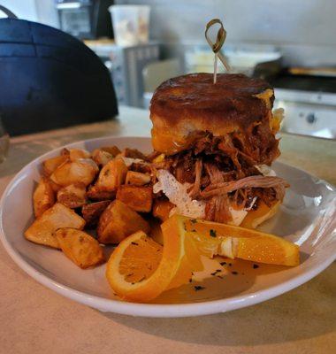 This stuffed grilled cheese biscuit has egg, pulled pork and cheese comes with potatoes and it's only $8!