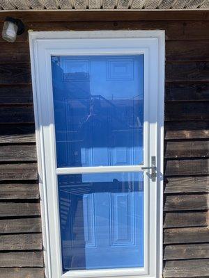 Final installation of exterior door and storm door on beach condo