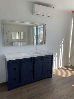 This is our 60x30 LED mirror with a 60" matte blue barn style vanity