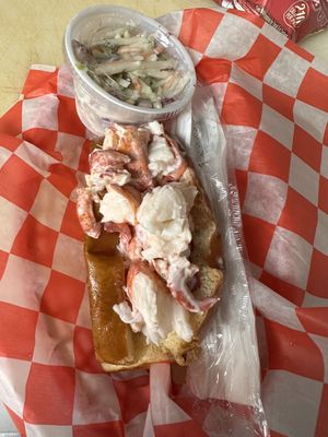 Lobster Roll on a great bun, pickle , chips and cole slaw