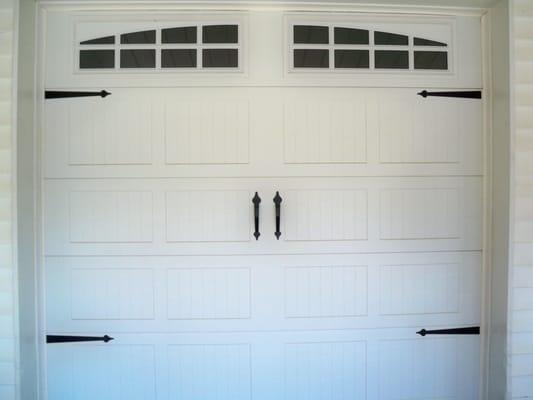 The carriage house door in white.