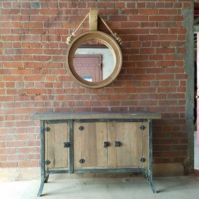 Reclaimed industrial style latge cabinet and antique tire mold mirror