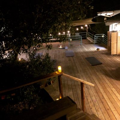 Outdoor candlelit yoga deck