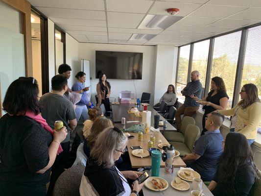 The Fedelta team enjoys a team potluck at the office