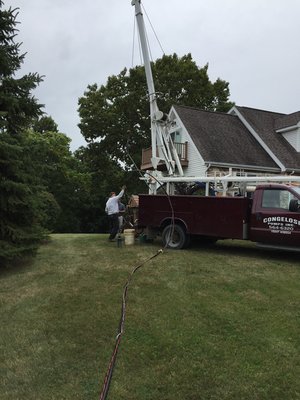 Pulling a submersible well pump on poly pipe.