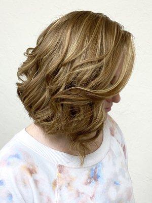 Blonde highlights on a textured bob haircut.