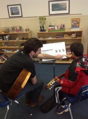 Mr Eric teaches a guitar lesson