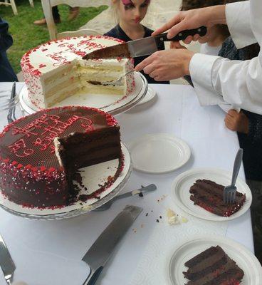 Our servers cutting the Birthday cake and serving it to the guests