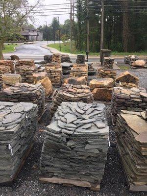 Various pallets of natural stone for garden walls