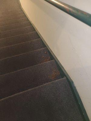 Caked on dirt left on staircase