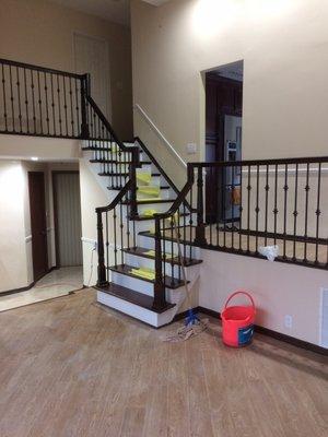 Staircase remodeling, railing and balusters replacement with custom spray finish