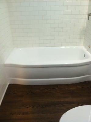 White subway tile with epoxy grout.