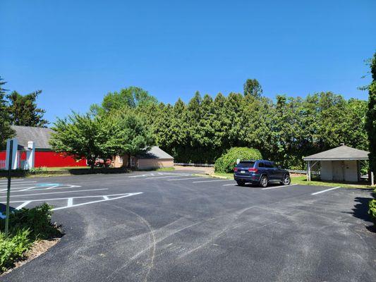 There is a large parking lot with an accessible entryway.