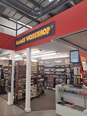 They sell Games Workshop, role playing books/models, and some board games at The Art Store in addition to their regular art supplies.