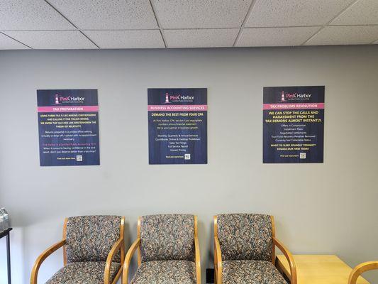 View of sitting area and signs above chairs of Pink Harbor, CPA