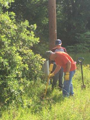 Looking for said set corners, using metal detector.