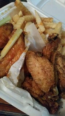 Thai Chili and Honey Garlic wings with french fries.