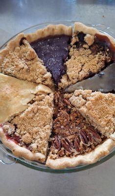 A pie sampler of various fresh pie slices that was freshly baked that morning.  Includes Whiskey Apple & Mixed Berry to name a few.