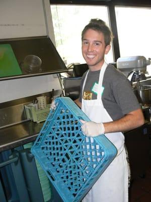 A Boston Cares volunteer helping out in our kitchen