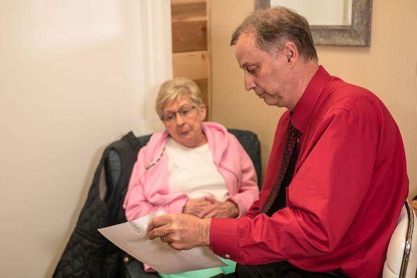 Dr. Thomas Huffman, MD explains lab results to a patient at Freedom Health.