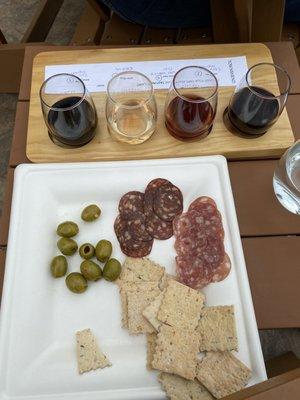 Syrah, Riesling, dessert cab and Merlot. Pepper olives, salami and cracker.