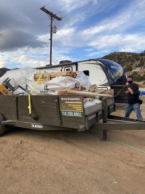 The way our materials showed up! Half falling off, propane tanks!, random tools hanging off the back of trailer.