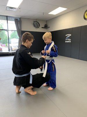 Brazilian Jiu-jitsu belt promotion kids class