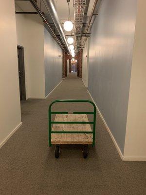 Wide hallway, small cart. How does this happen?